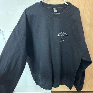 Sweatshirt with a ghost and “spooky season” on the chest